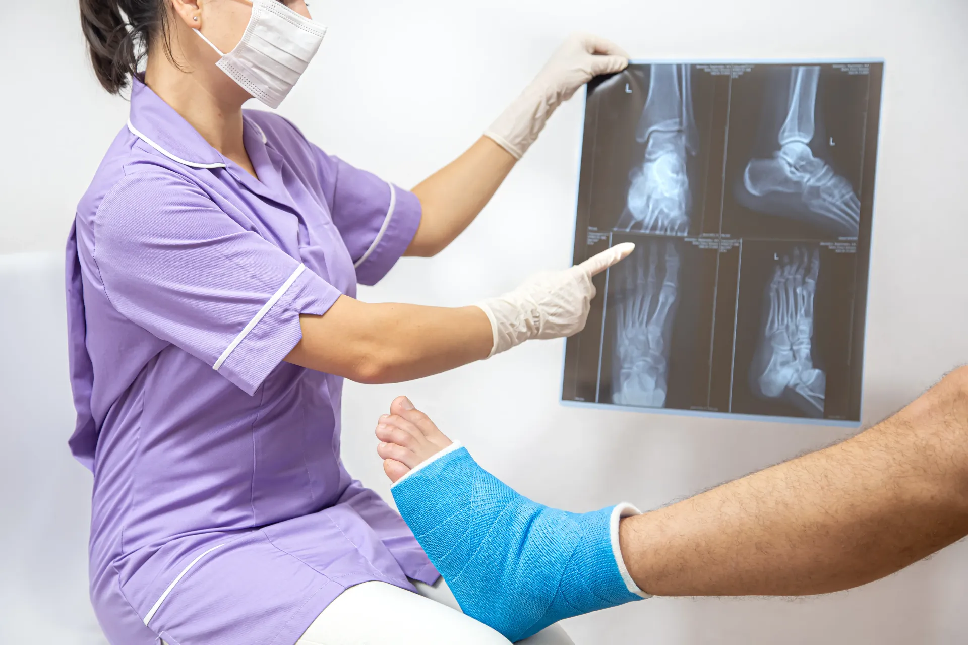 bone-fracture-foot-leg-male-patient-being-examined-by-woman-doctor-hospital.webp