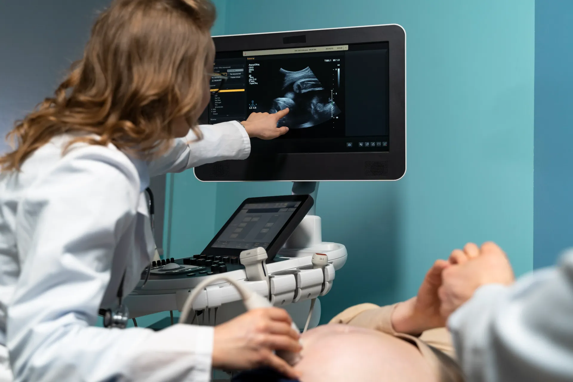 gynecologist-performing-ultrasound-consultation.webp